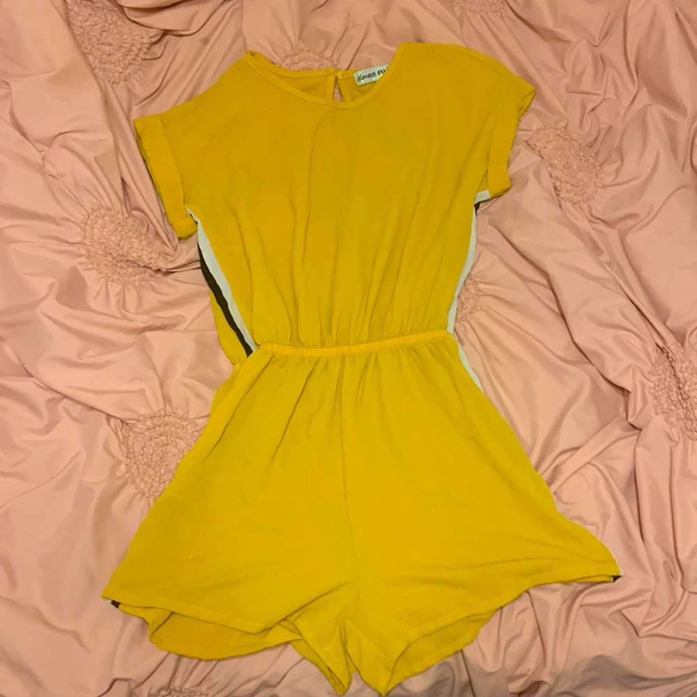 This romper is unworn and clean, fits a little loose, and definitely for sale.